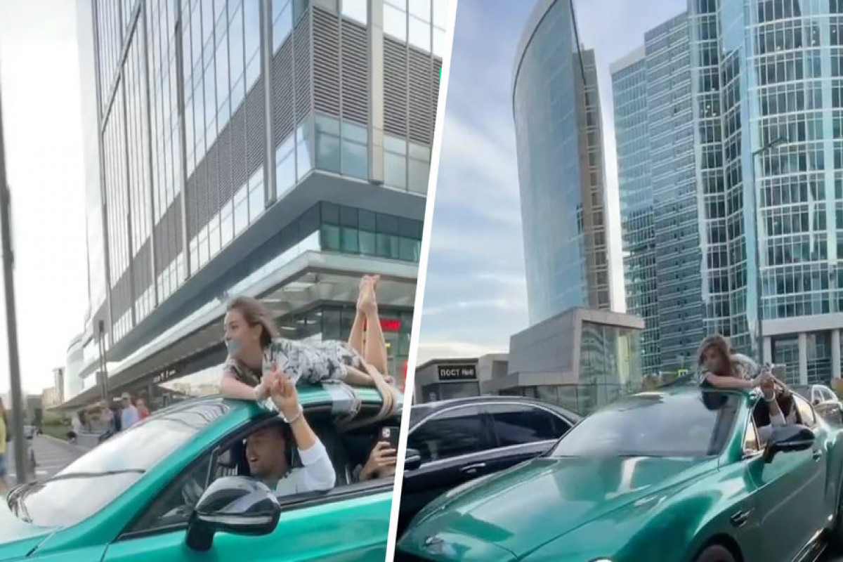 Блогер привязал свою девушку к крыше машины и прокатил по Москве-ВИДЕО 